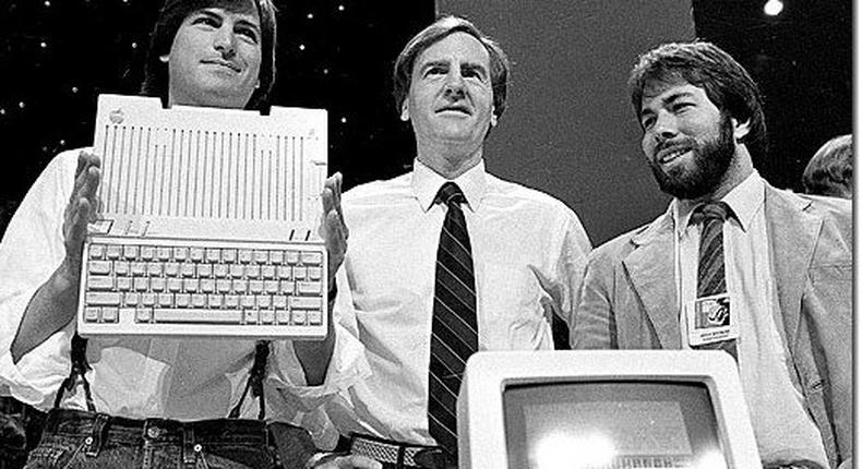 Apple Co-founders Steve Jobs (left) and Steve Wozniack (far right) at the Apple IIc launch on April 24, 1984. 