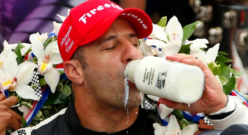 Driver Tony Kanaan of Brazil takes the traditional drink of milk after winning the 97th running of the Indianapolis 500 at the Indianapolis Motor Speedway.Jeff Haynes/Reuters