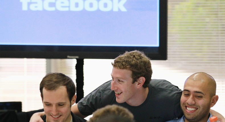 Facebook founder and CEO Mark Zuckerberg greets Facebook employees before speaking at a news conference at Facebook headquarters on on October 6, 2010.
