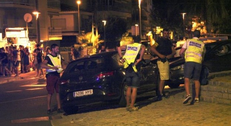 Police inspect the vehicle used in the Cambrils attack