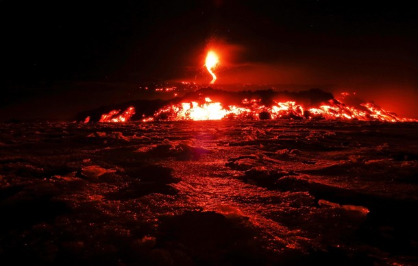 Italy's Mount Etna, Europe's tallest and most active volcano, spews lava as it erupts on the souther