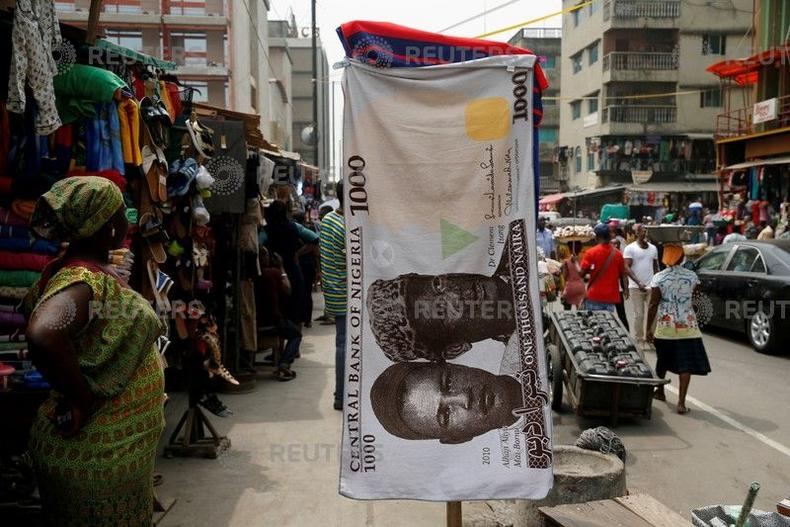 A towel with a print of the Nigerian naira is displayed for sale at a street market in the central business district in Nigeria's commercial capital Lagos February 4, 2016. 