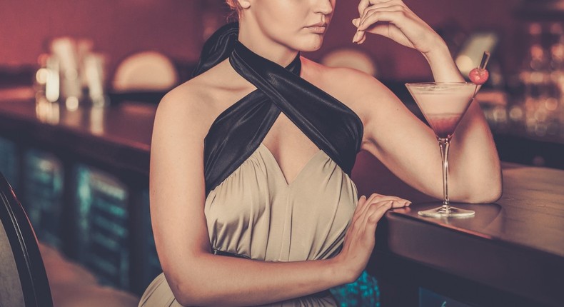 woman sitting at the bar