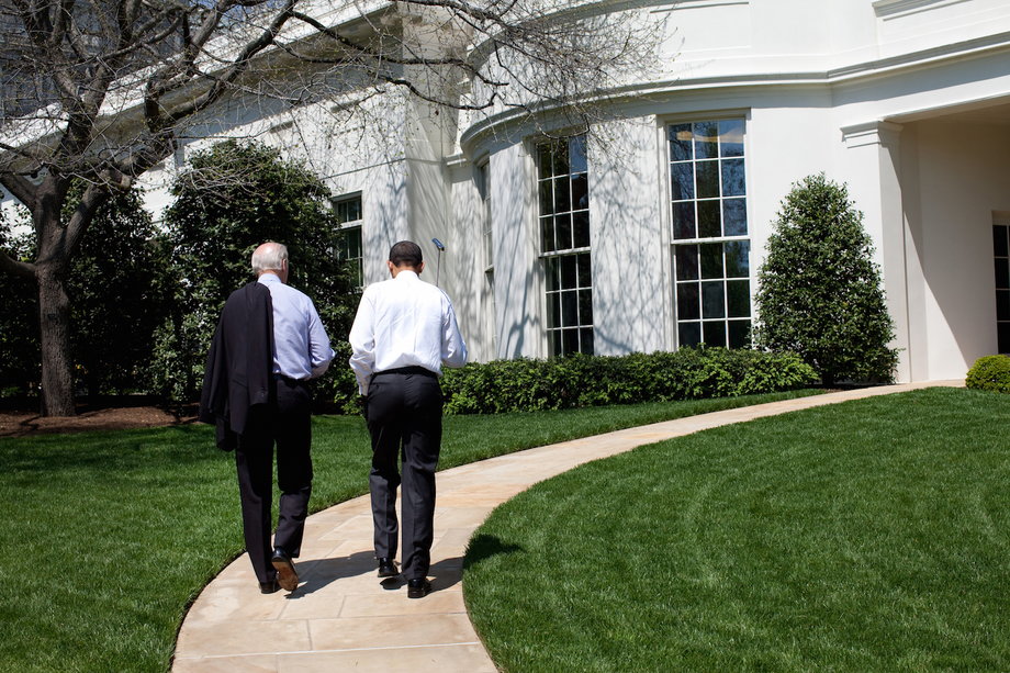 Obama and Biden walk back to the Oval Office after putting on the White House putting green April 24, 2009.