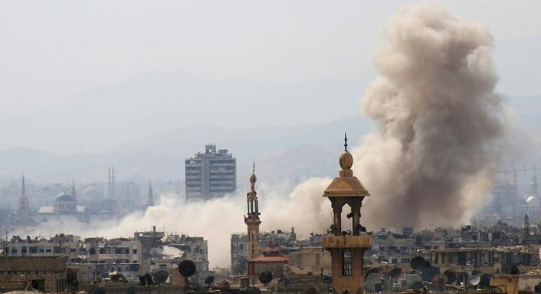 Smoke billows following a reported air strike in rebel-held parts of Jobar on the eastern outskirts of Damascus, on March 19