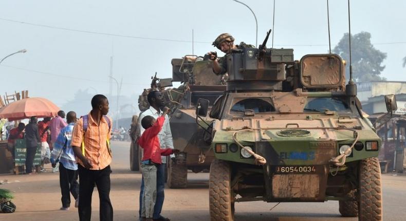 French Sangaris forces patrol in Bangui, Central African Republic in February 2016 as people vote in presidential elections hoping to bring peace after the country's worst sectarian violence since independence in 1960