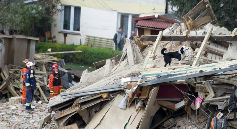 Rescuers search after a building collapsed burying several people in Swiebodzice, Poland on April 8, 2017