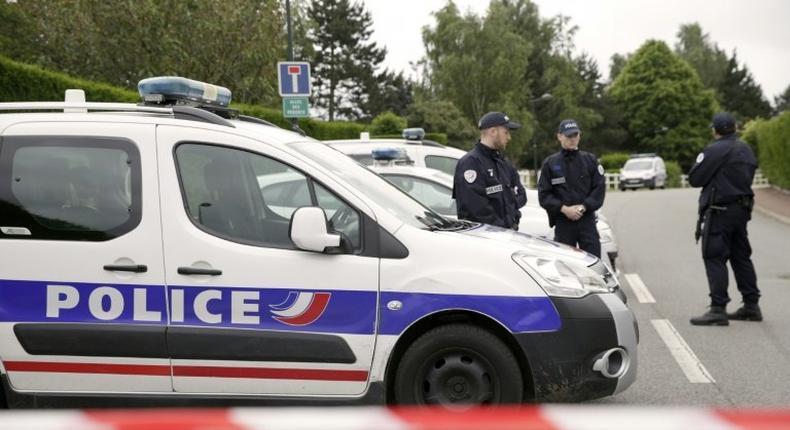 Police cordon off a street in Magnanville, northern France after a man claiming allegiance to the Islamic State group killed two people on June 13, 2016 