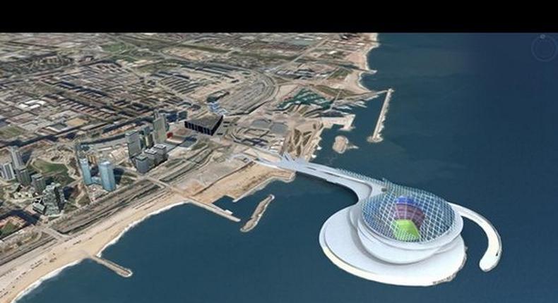 A 150,000-seat stadium off the bay of the city, linked by a bridge.