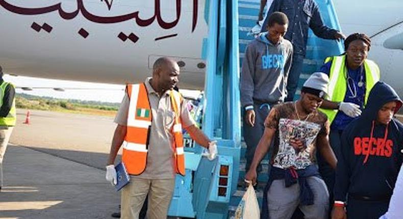 Nigerians alighting the plane from Libya