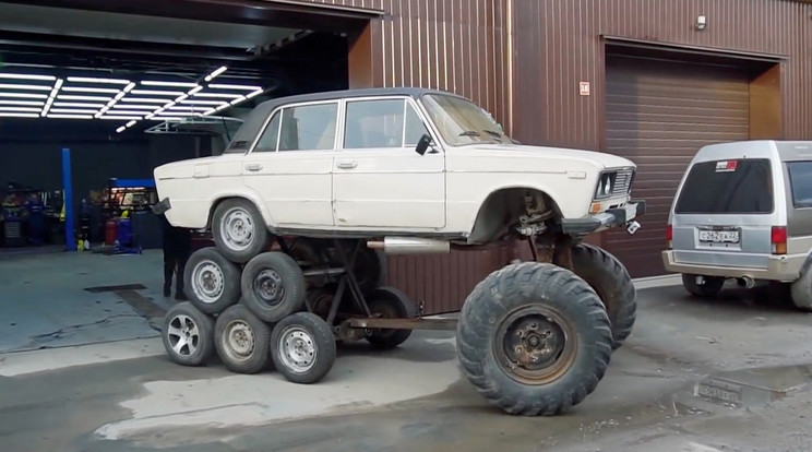 Old Lada car goes up win the world by becoming a 14 wheel monster