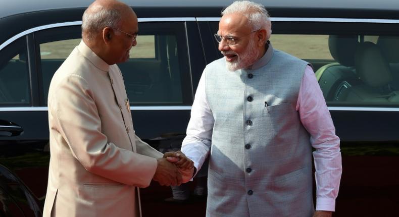 Pakistan has denied India's president the right to fly through its airspace in a new escalation of tensions; India's Prime Minister Narendra Modi (R) is pictured welcoming India's President Ram Nath Kovind in New Delhi on August 21, 2019
