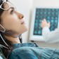 Charming young woman undergoing electroencephalography