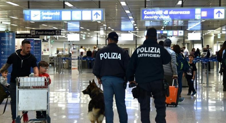 Italian police officers patrol at Rome's Fiumicino aiport