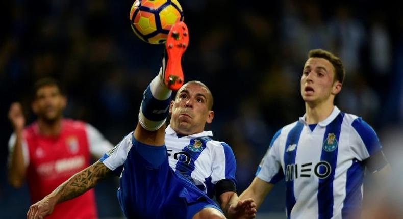 Porto's Uruguayan defender Maxi Pereira(L) in action against SC Braga: his team are chasing a Champions League spot