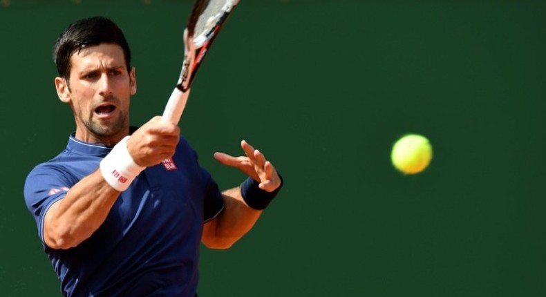 Serbia's Novak Djokovic hits a return to French's Gilles Simon during the Monte-Carlo ATP Masters Series tournament on April 18, 2017 in Monaco