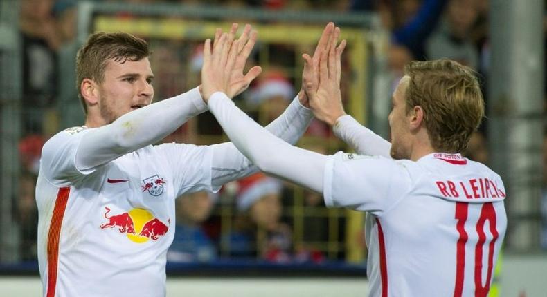 Leipzig's forward Timo Werner (L) celebrates with teammate forward Emil Forsberg after he scored during the German first division Bundesliga football match against SC Freiburg November 25, 2016