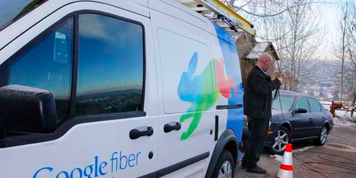 A technician gets cabling out of his truck to install Google Fiber in a residential home in Provo, Utah, on January 2, 2014.