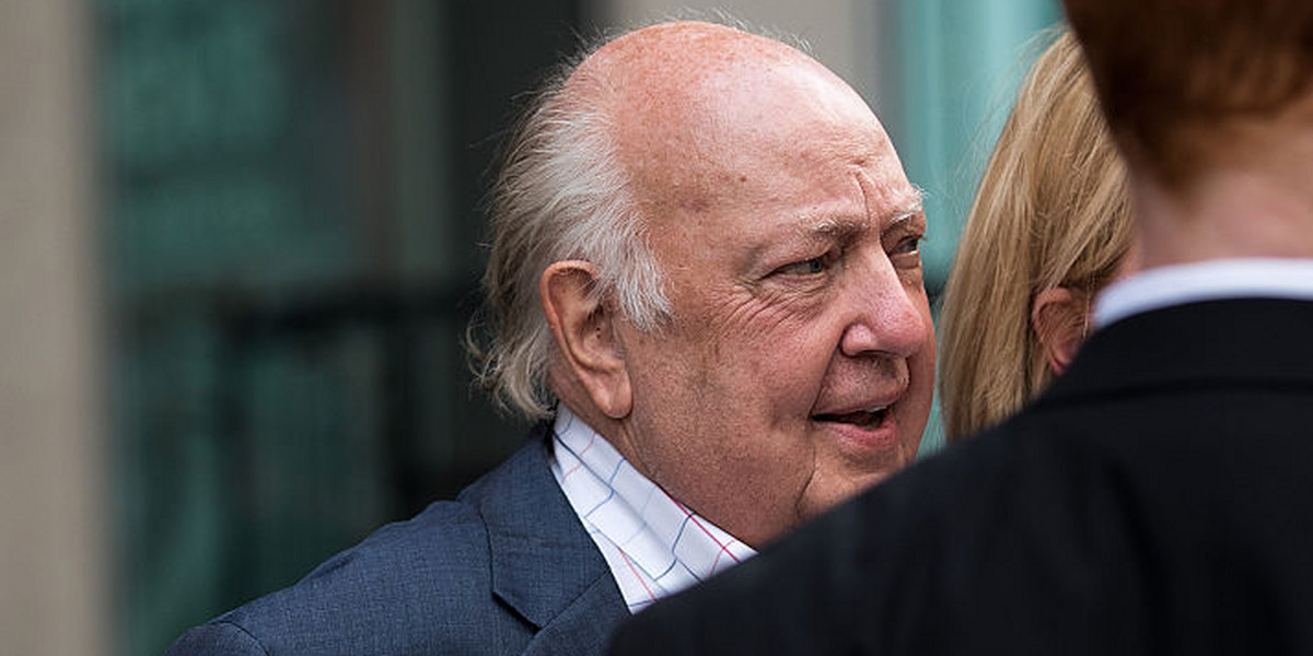 Security stands in front of Fox News Chairman Roger Ailes as he leaves the News Corp. building on July 19 in New York City.