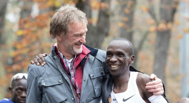 Eliud Kipchoge celebrates with Ineos owner Jim Ratcliffe after the Kenyan broke the two-hour marathon barrier in an event heavily sponsored by the petrochemicals company