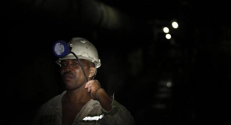 A mine worker is seen underground  at Lonmin's Karee mine in Rustenburg, 100 km (62 miles) northwest of Johannesburg, March 5, 2013.   REUTERS/Siphiwe Sibeko