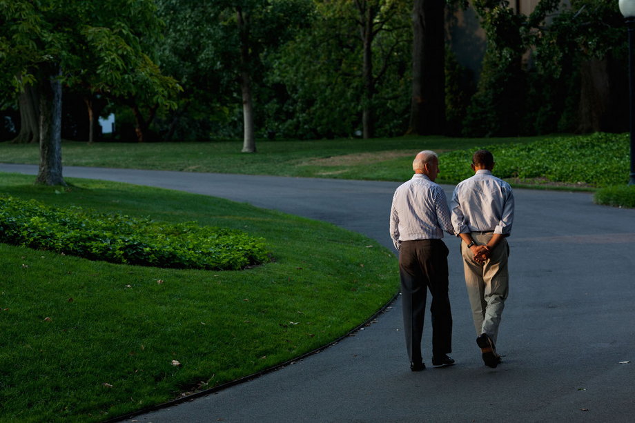 Obama and Biden walk around the South Lawn of the White House, Sunday, July 24, 2011.