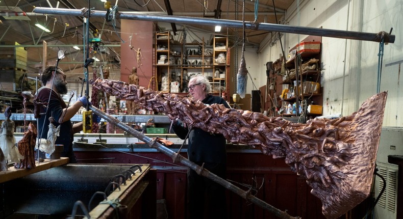 Danish sculptor Jens Galschit (right) with a Pillar of Shame.