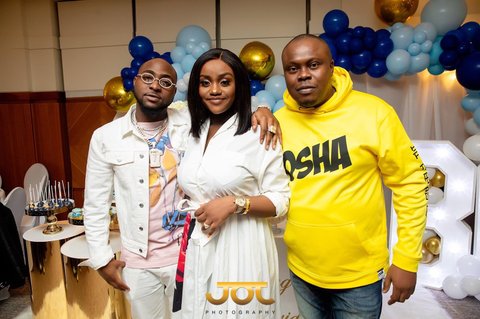 Davido, Chioma and Bankulli at the naming ceremony of Davido's son, Ifeanyi David Adeleke. (Bankulli)