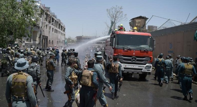 Hundreds of demonstrators calling for President Ashraf Ghani to step down and chanting Death to the Taliban clashed with police near the bombing site, prompting officials to respond with live rounds, tear gas and water cannon