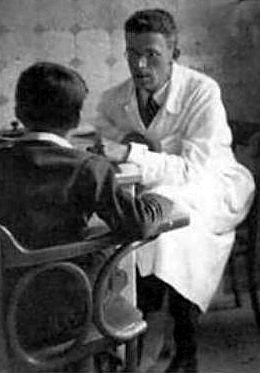 Hans Asperger (1906–1980) at work in the University Pediatric Clinic, Vienna (now part of the Vienna General Hospital), performing a psychological test of a child. The photograph was taken c. 1940, around the time of Asperger&#39;s discovery of autism.