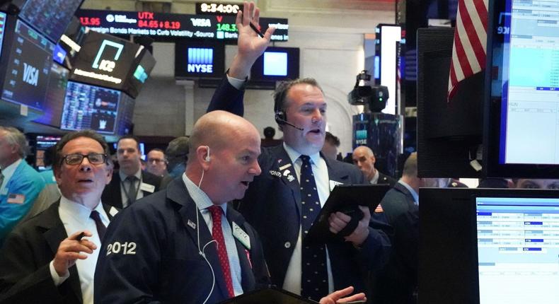 Traders work on the floor at the opening bell of the Dow Industrial Average at the New York Stock Exchange on March 18, 2020 in New York.Bryan R. Smith/AFP/Getty Images