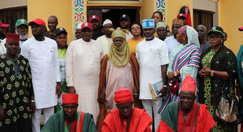 City Boys Movement and National Coalition Group members in group photograph with Mai Girma, the Sapeyi of Garki, Abuja, Dr Usman Ngakupi. [NAN]