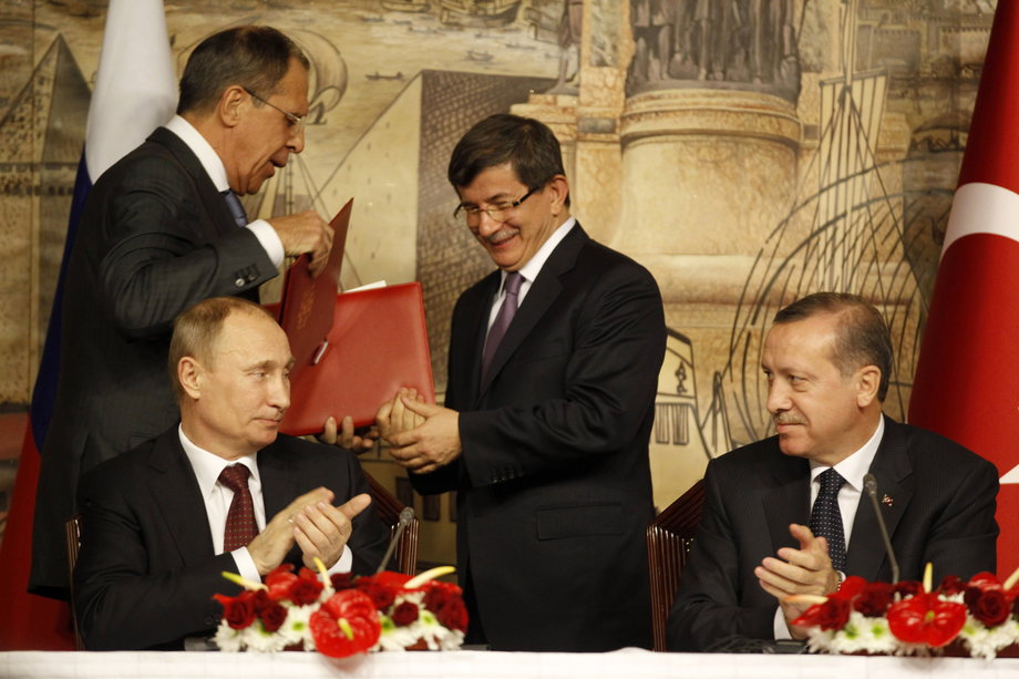 From left: Putin, Russian Foreign Minister Sergey Lavrov, former Turkish Prime Minister Ahmet Davutoglu, and Erdogan.
