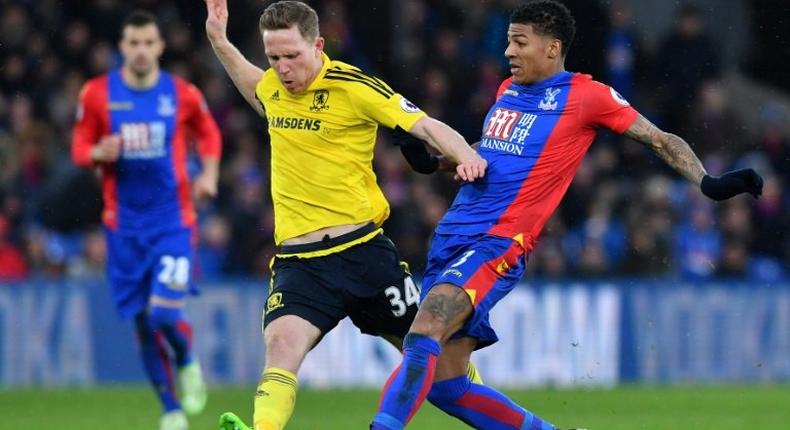 Middlesbrough's midfielder Adam Forshaw (L) vies with Crystal Palace's defender Patrick van Aanholt during the English Premier League football match February 25, 2017