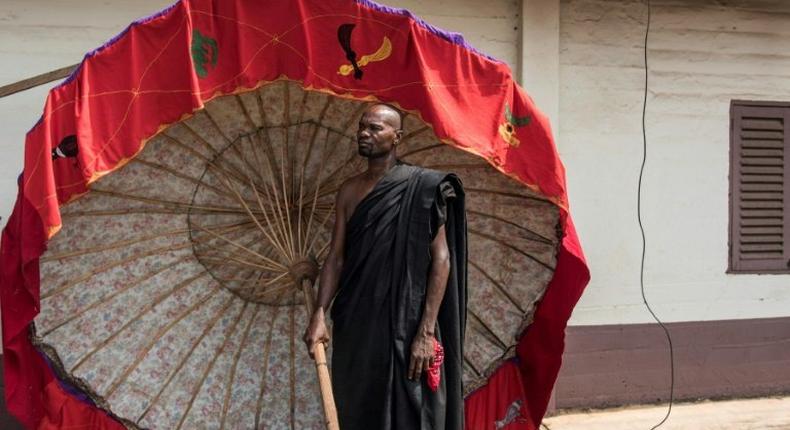 A man carrying a tradionnal umbrella in Kumasi on November 24 at a ceremony following the death of Nana Afia Kobi Serwaa Ampem II