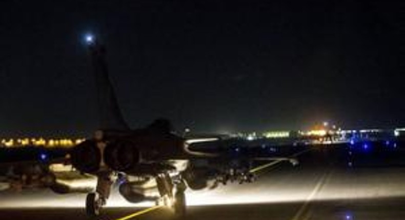 France launches air strikes in Syria; Paris investigation widens