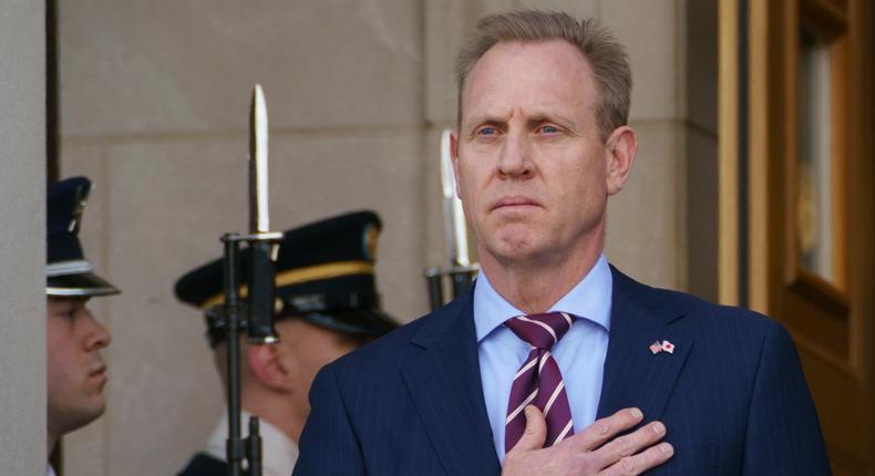 Acting Secretary of Defense Patrick Shanahan, left, holds his hand over his heart during the National Anthem as he hosts an arrival ceremony for Japan's Defense Minister Takeshi Iwaya at the Pentagon, Wednesday, Jan. 16, 2019.