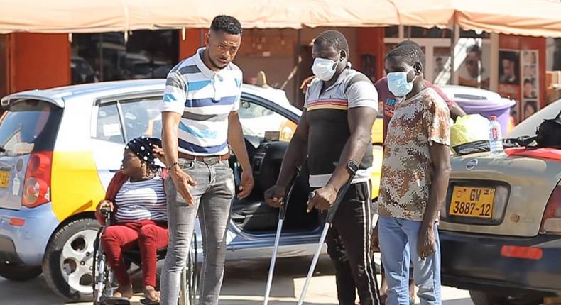 Ghanaian policeman gives to the physically challenged