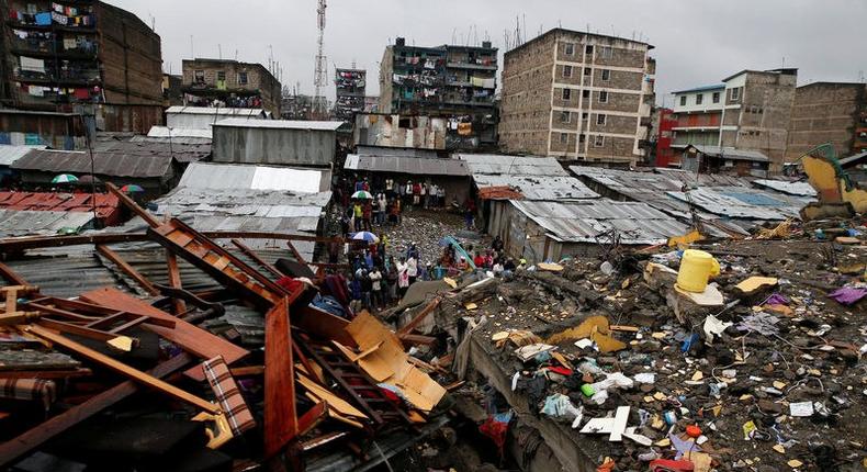 A general view shows rescue workers searching for residents feared trapped in the rubble of a six-storey building that collapsed after days of heavy rain in Nairobi, Kenya, May 1, 2016. 