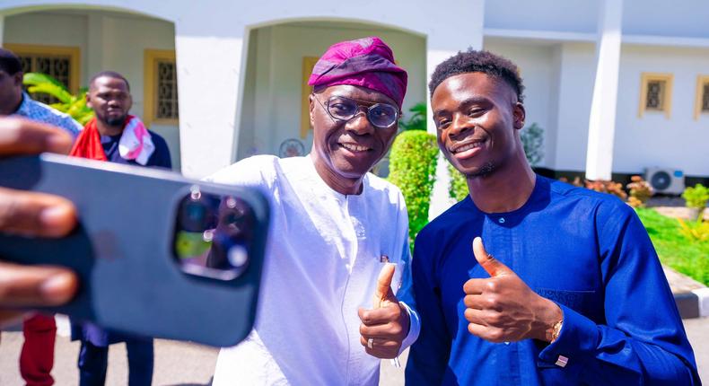 L-R: Gov. Babajide Sanwo-Olu of Lagos State and Arsenal Forward, Bukayo Saka take a selfie during a courtesy visit to the Governor, at the Lagos House, Marina, on Friday, June 3, 2023. [Twitter:Jagbros]