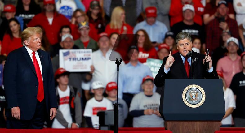 Television personality Sean Hannity, right, speaks as President Donald Trump listens during a campaign rally Monday, Nov. 5, 2018, in Cape Girardeau, Mo. (AP Photo/Jeff Roberson)