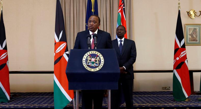 Kenya's President Uhuru Kenyatta and his Deputy William Ruto deliver a statement to members of the media at the State House in Nairobi.