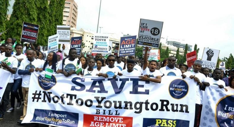 About 500 protesters in Nigeria, wearing white T-shirts and brandishing placards proclaiming #NotTooYoungToRun, marched two kilometres to the National Assembly