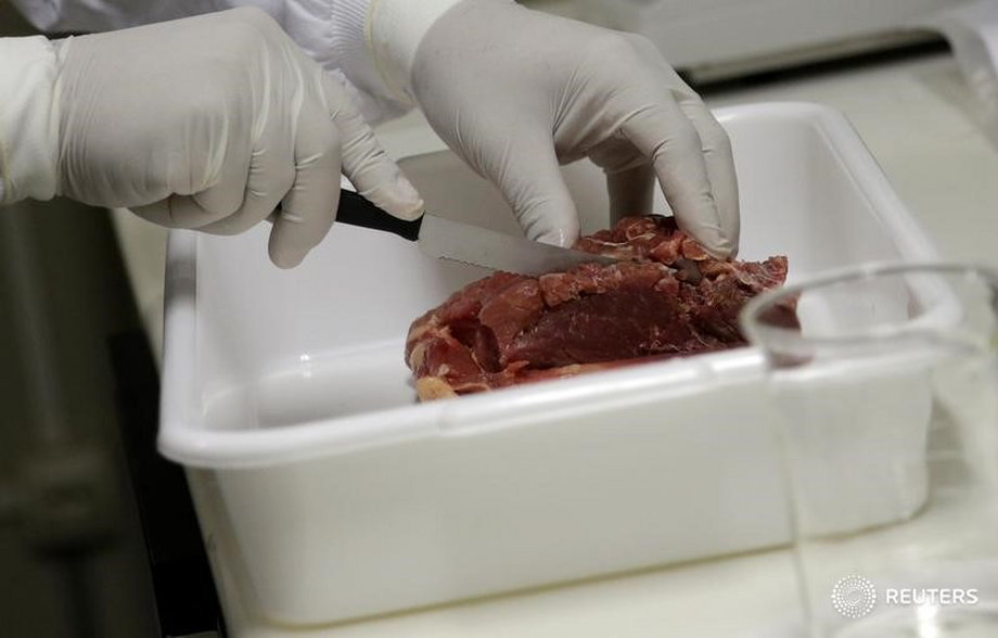 A veterinarian analyses meat collected by Public Health Surveillance agents in a supermarket inspection, in Rio de Janeiro, Brazil, March 20, 2017.