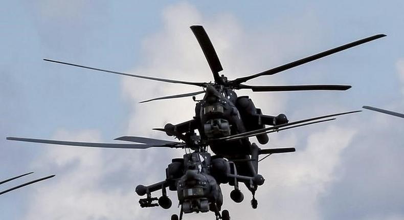 Russian Mi-28Ns from the Berkuty (Golden Eagles) helicopter display team fly in formation during the Aviadarts military aviation competition at the Dubrovichi range near Ryazan, Russia, August 2, 2015. REUTERS/Maxim Shemetov