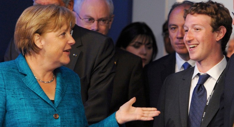 Angela Merkel and Mark Zuckerberg joking in 2011.