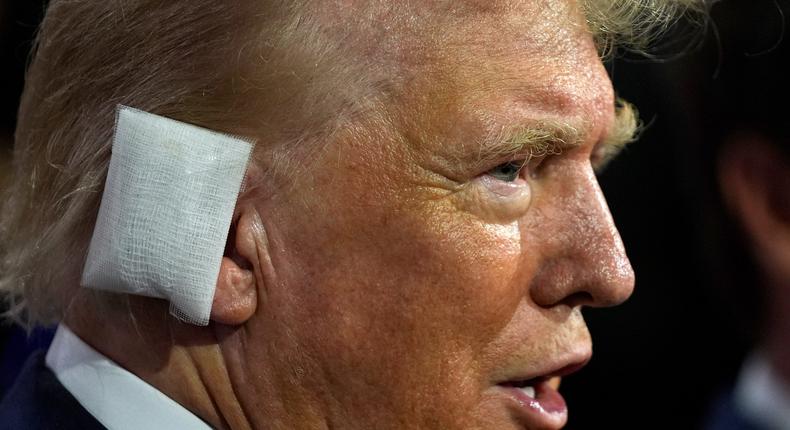 Former President Donald Trump sporting a huge bandage on the first day of the Republican National Convention in Milwaukee.Evan Vucci/AP