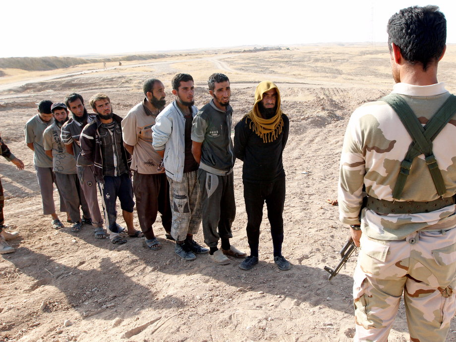 Kurdish Peshmerga forces detain Islamic State militants southwest of Kirkuk, Iraq on October 5, 2017.