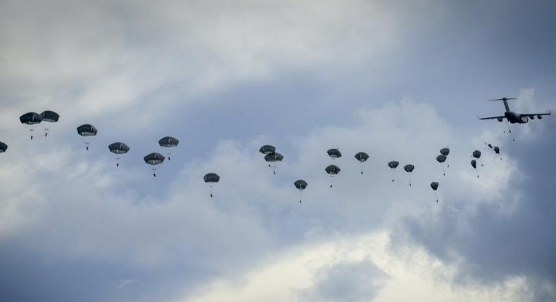 Paratroopers of the 4th Infantry Brigade Combat Team (Airborne), 25th Infantry Division, U.S. Army Alaska, demonstrate a joint forcible entry into Andersen Air Force Base, Guam, June 30