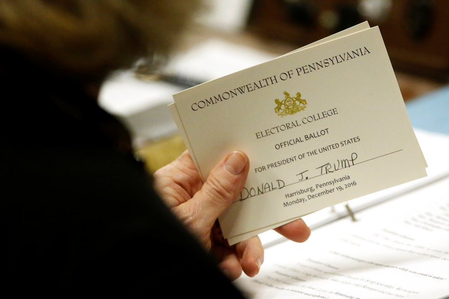 Pennsylvania elector Carolyn Bunny Welsh holding her ballot for Trump before casting it at the Pennsylvania State Capitol in Harrisburg on Monday.